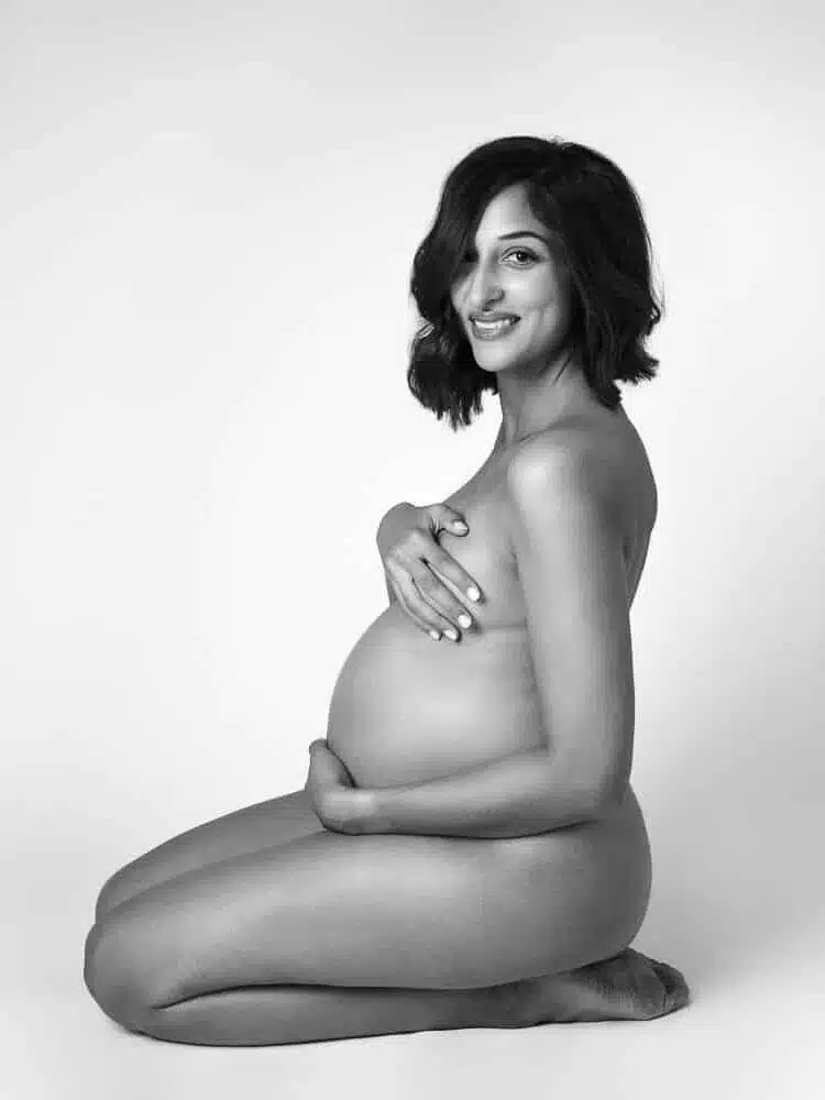 Capturing the Glow: A Guide to Studio Maternity Photography 12 Maternity portrait - Zesty Orange Photography by Olesya Redina