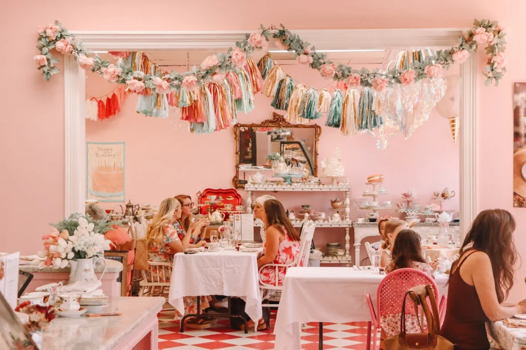 Elegant table setting for an afternoon tea baby shower at Austin English Tea Company, featuring vintage china, tiered trays with pastries, and floral centerpieces in a cozy, sunlit Austin tearoom.