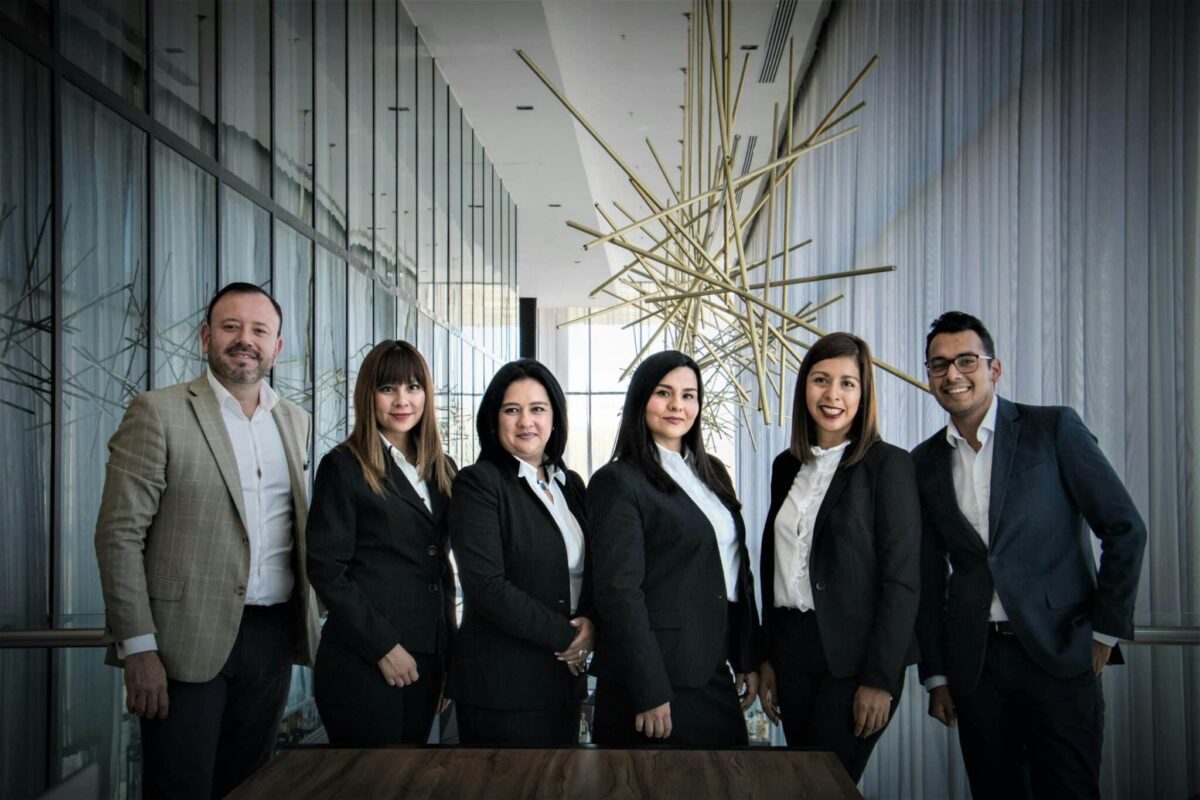 Plan Corporate Headshots: 8 Steps for Seamless Company Portraits 2 Plan Corporate Headshots Diverse business team in formal attire posed in modern office.