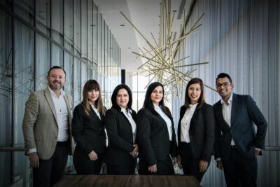 Plan Corporate Headshots: 8 Steps for Seamless Company Portraits 43 Plan Corporate Headshots Diverse business team in formal attire posed in modern office.
