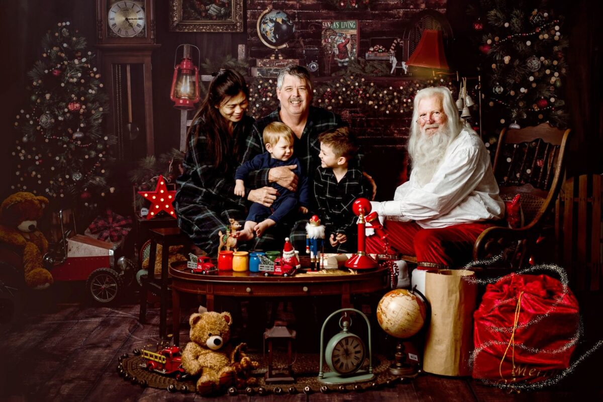 Photos with Santa Austin: Holiday Traditions Matter for Family 1 Family sharing a heartwarming moment with Santa Claus, captured in a professional holiday photo session near Austin | Photos with Santa Austin
