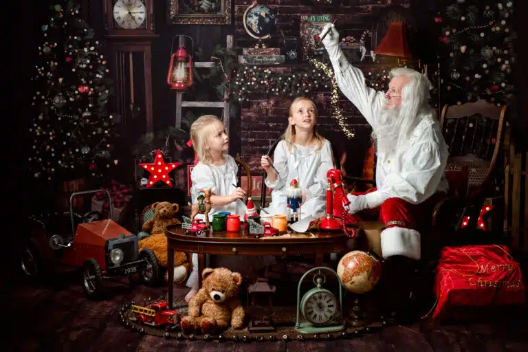 Candid laughter as children interact with Santa, surrounded by cozy, festive set details in Austin’s premier Santa portrait experience | Santa Pictures Austin | Santa Photos Austin